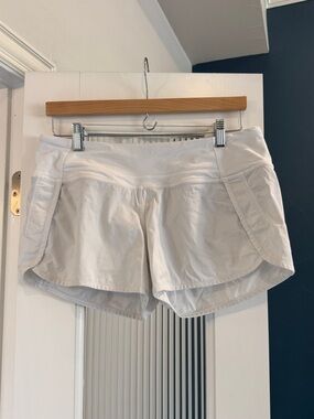 Lululemon Women's White Athletic Shorts with Built-In Liner, 4” size 8
